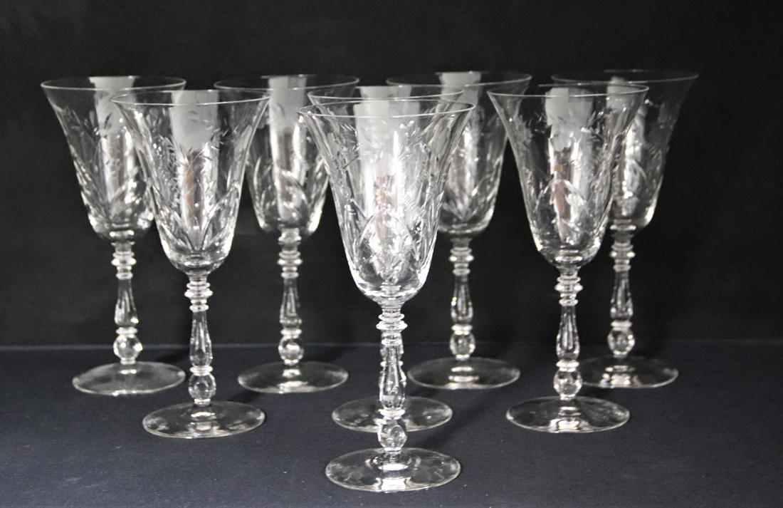 Collection of Tulip Shaped Wine Glasses: Eight decorative etched cocktail stemware; Measures approximately H 8 x 3 3/4 diameter inches across the top; No makers mark; Minor chip in one of the glass sides. See photos.