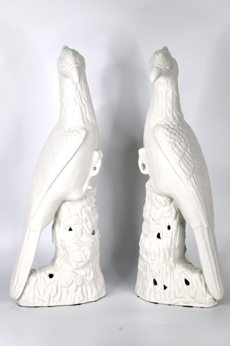 Mottahedeh, Porcelain Birds: Mirrored pair of white porcelain birds, possibly falcons; Tag on inside base reads "A Mottahedeh Design" and each piece is stamped ITALY; Each measures approximately H 20 x W 8 x D 5 inches; Pieces ha