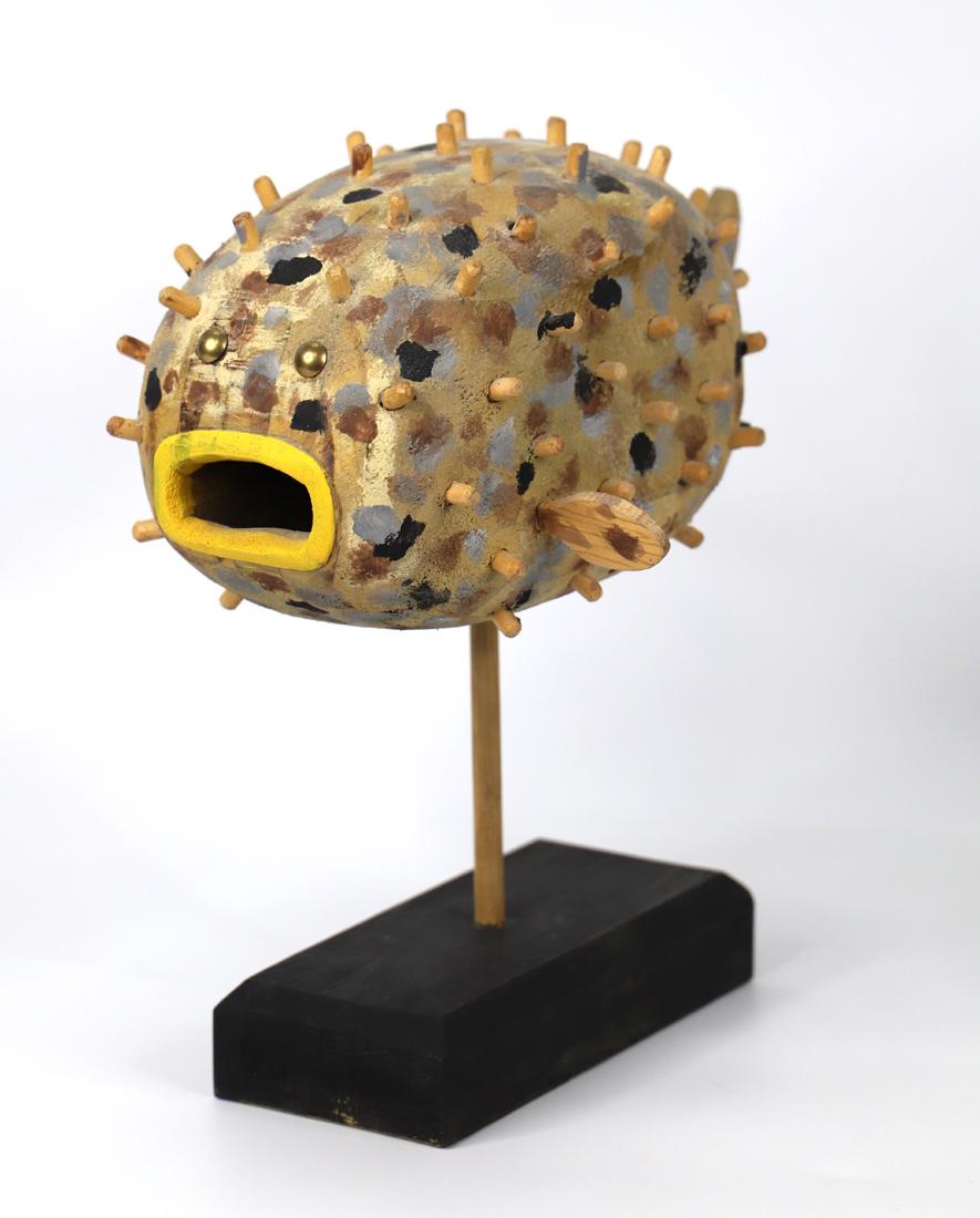 Ken Lessnau, Wooden Sculpture: Painted wood sculpture of a puffer fish; Mounted on a wooden base; Artist signature on bottom right side of fish; Measures approximately H 10 x W 12 x D 8 inches. No damage observed. See photos
