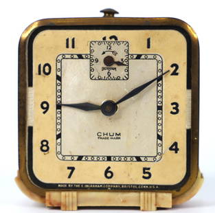 Ingraham, Vintage Alarm Clock: Vintage alarm clock; Hand-wind mechanism; Clock face reads "Ingraham Chum Trade Mark Made by the E. Ingraham Company. Bristol Conn. USA"; Metal case with faux marble plastic base; Case is age worn wit