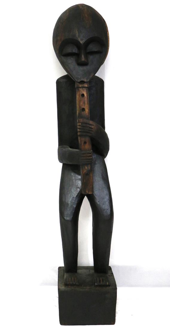 Carved Tribal Figure: Standing carved wood figure, possibly ebonized; Measures approximately H 40 1/2 x W 8 x D 7 inches; Large crack in head. See photos ***In-house shipping is NOT available for this item. To have this it