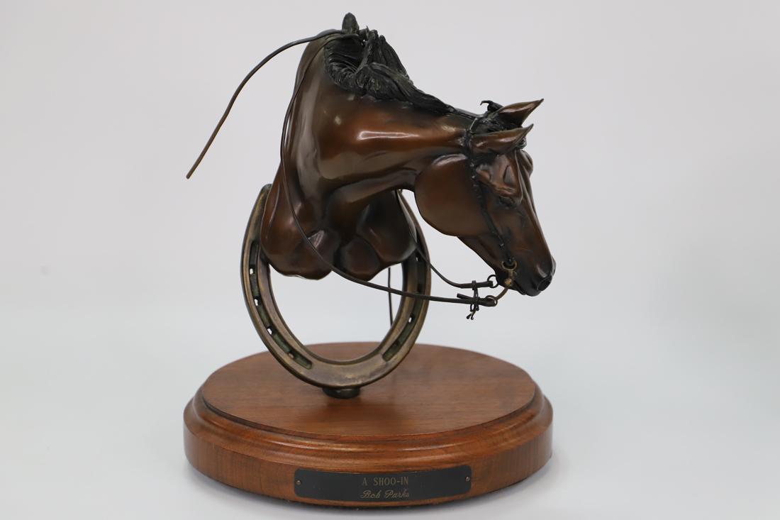 Bob Parks, Bronze Sculpture: Bronze sculpture titled "A Shoo-In"; Artist signed and numbered 3/35 on back; Sculpture is mounted on a wooden swivel stand that has a plaque with sculpture title and artist name; Measures approximate