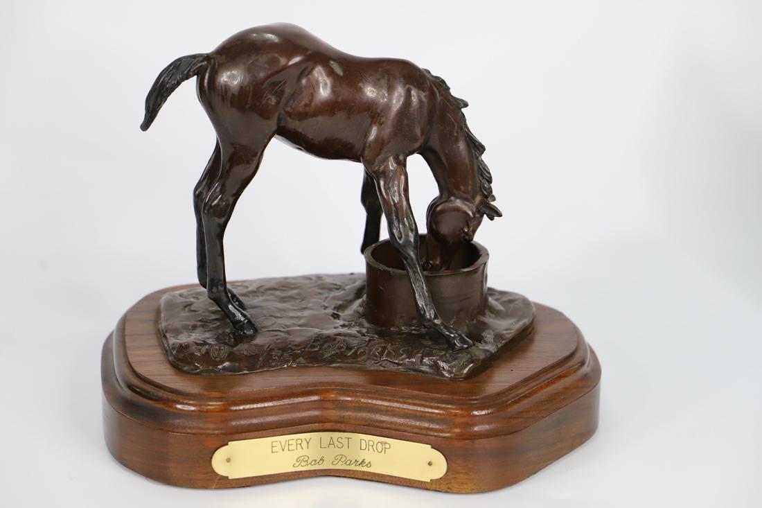 Bob Parks, Bronze Sculpture: Bronze sculpture titled "Every Last Drop"; Artist signature and number 10/35 on base; Sculpture is mounted on a wooden stand that has a plaque with sculpture title and artist name; Measures approximat