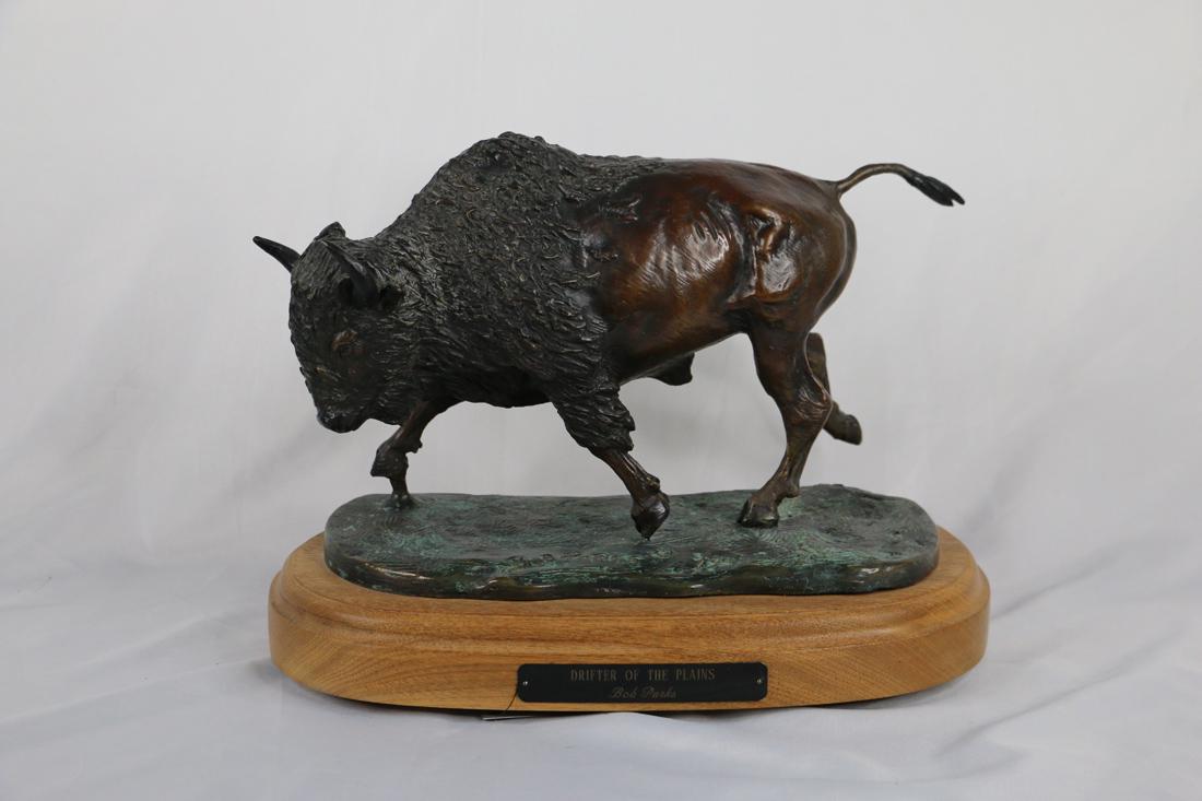 Bob Parks, Bronze Sculpture: Bronze sculpture titled "Drifter of the Plains"; Artist signature and numbered 3/30 on base; Sculpture is mounted on wooden swivel stand that has a plaque with sculpture title and artist name; Measure