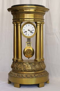 French Portico Clock: Vintage metal clock with porcelain face; No maker marks observed; Measures approximately H 24 1/4 x W 13 1/2 x D 6 1/2 inches; No key; Working condition unknown; Cracking on the face; See photos. Pick