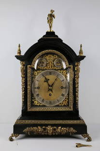 English Black Bracket Clock: Three Fusee clock with gold tone detailing; No maker mark observed; Marked on front "Chime on eight bells - Chime on four gong"; Working condition unknown; Key present; Pull chain to hear chimes on si