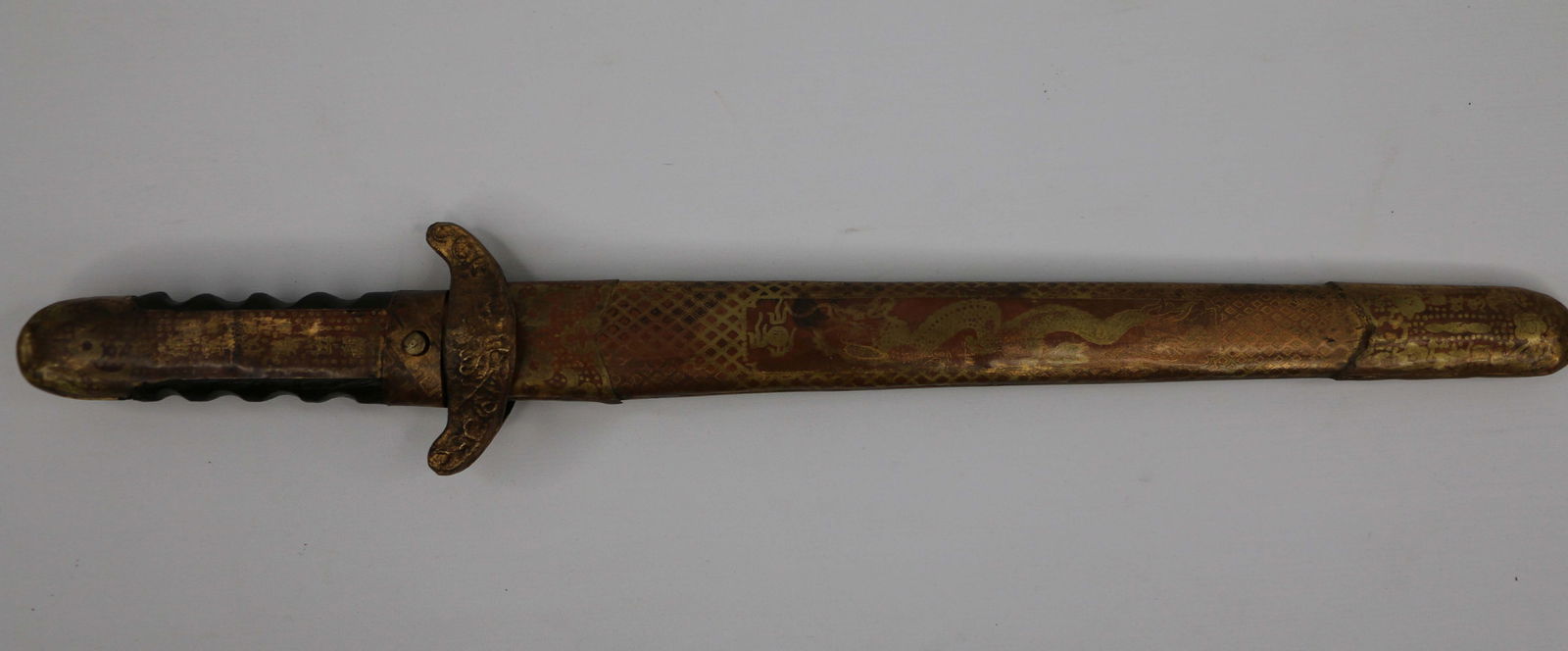 Vintage Asian Knife: Leather and metal handle with metal sheath; Character marks on sheath; Unable to open; Measures approximately H 16 x W 2 1/2 inches; Wear commensurate with age; See photos. Pick up in Denver