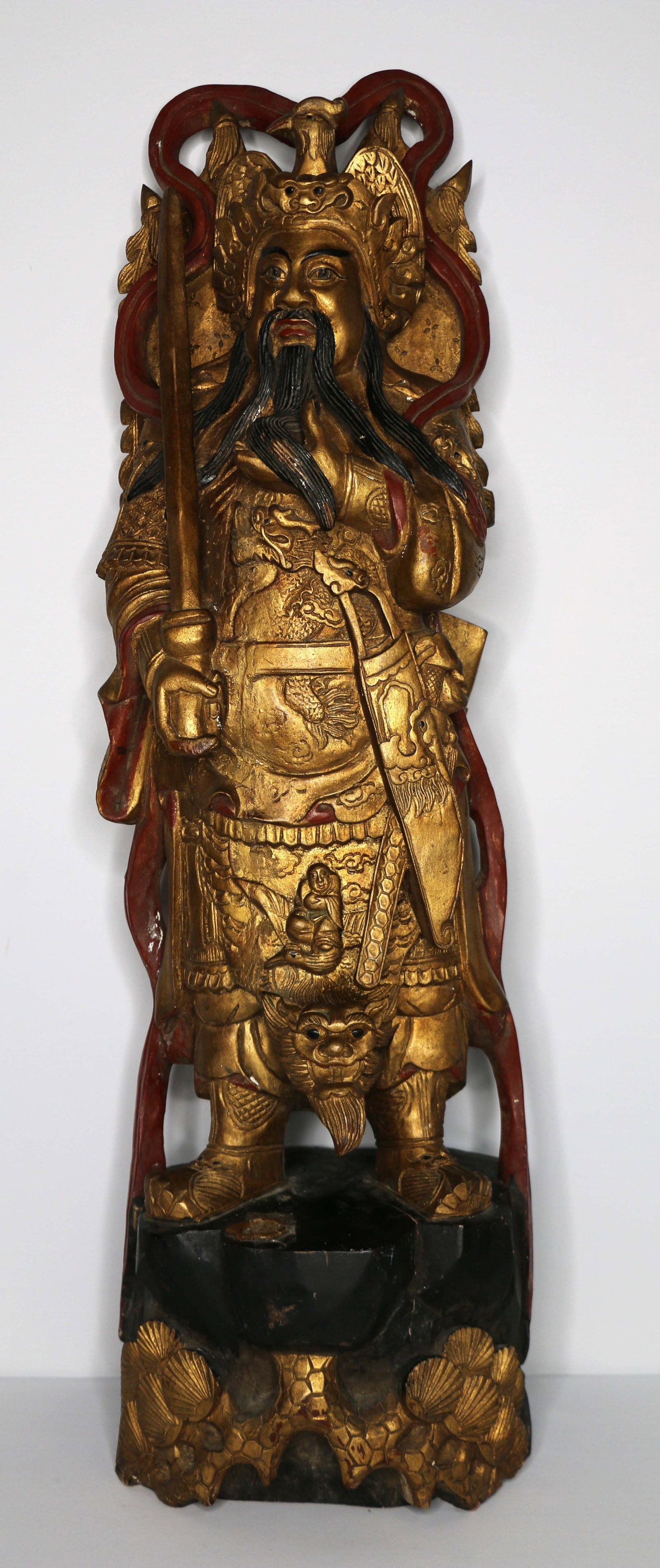Chinese Immortal Carving: Gilt, lacquered wood carving; Has a wax seal that has been taped over; Possibly late Ching Dynasty; Measures approximately H 31 x W 9 x D 8 inches; Crack in wood on face; See photos. Pick up in Denver