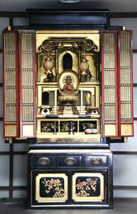 Japanese Butsudan Shrine: Japanese Buddhist family altar; Black/red lacquer wood gold gilt; Shrine sits on a base; Possibly late Showa period; Both pieces together measure approximately H 47 x W 20 x 17 1/2 inches; Small hole