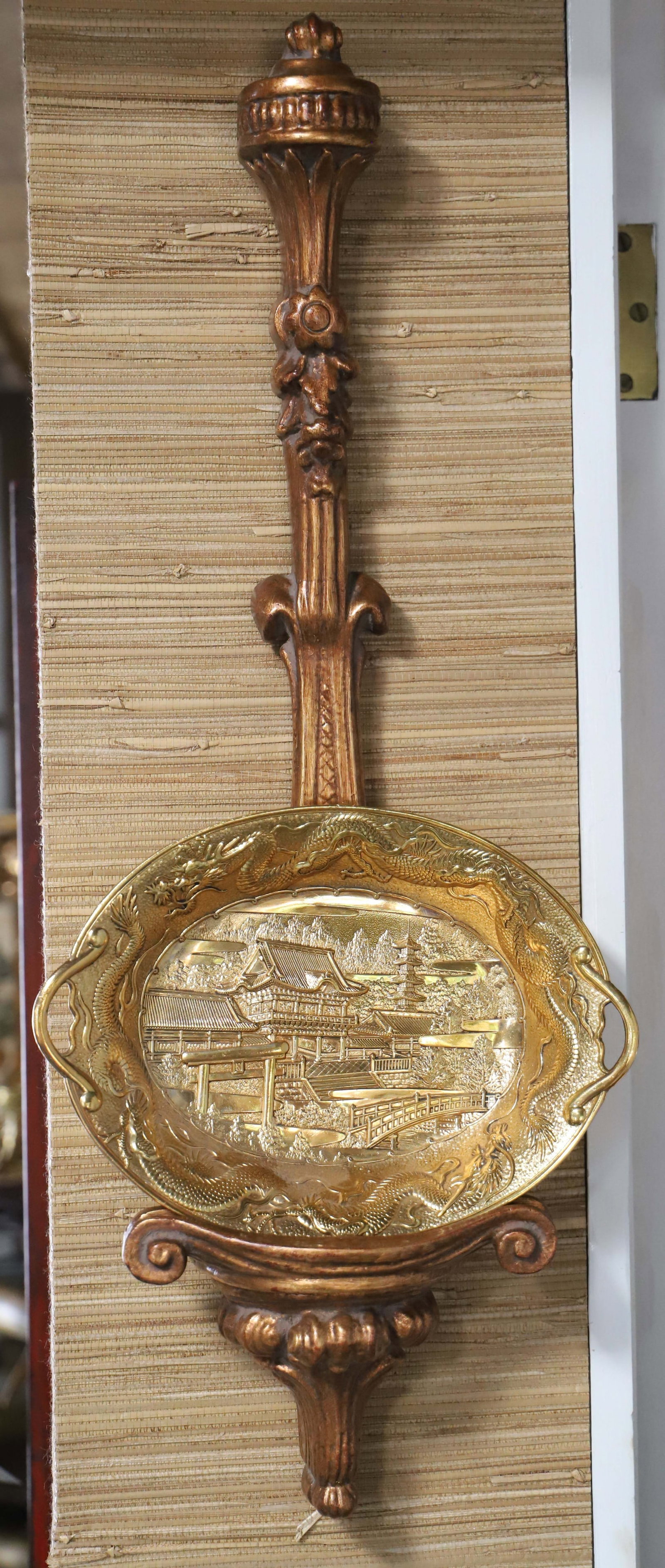 Japanese Bowl with Stand: Gold toned bowl with pagodas and dragons; Sits in a hanging wood rack; Marked "Made in Japan"'; Measures approximately H 1 1/2 x W 10 x D 8 inches; No damage observed; See photos. Pick up in Denver