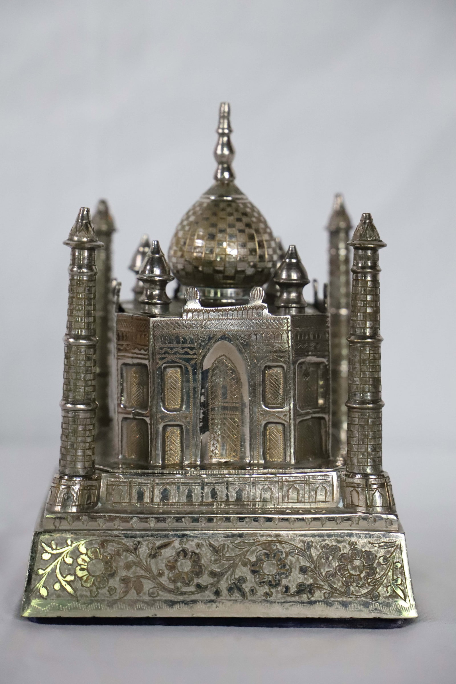 Taj Mahal, Music Box: Silver toned metal replica of the Taj Mahal; Building opens to reveal a velvet lined jewelry box and wind mechanism for the music box; No maker mark observed; Measures approximately H 7 x W 5 x D 5 in