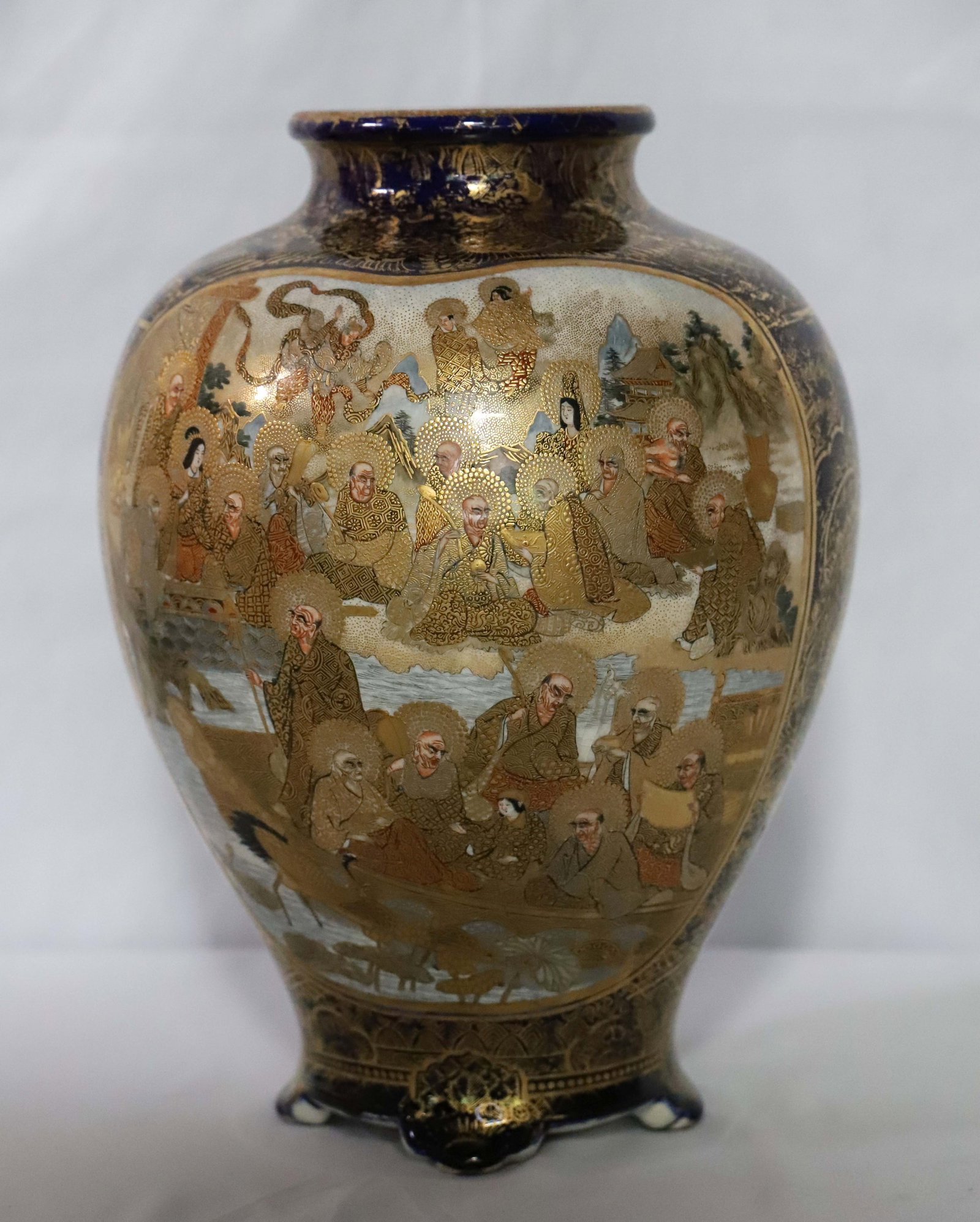 Satsuma Vase: Japanese Satsuma vase possibly late Meiji period; Unknown marks on the base; Measures approximately H 12 x Diameter 9 inches; Crazing along the rim and on base; Gold paint on rim is worn; See photos. 