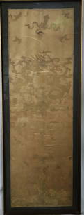 Chinese Silk Panel: Framed embroidered silk panel; Possibly from a roble; Dragon motif; Embroidered in gold tone silk; Dragon eyes and claws are highlighted with white silk thread; No maker mark observed; Visible area of