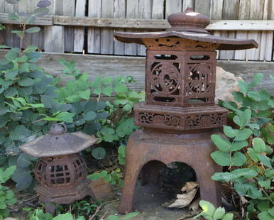 Japanese Lanterns: Two metal garden lanterns; No maker mark observed; Larger lantern separates into four pieces and is currently wired with a light inside; Largest lantern measures approximately H 21 x 26 Diameter inche