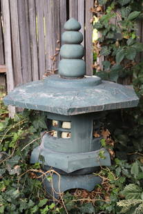 Japanese Garden Lantern: Large, pagoda shaped garden lantern; Undetermined material, possibly painted concrete; Lantern is constructed in stacked pieces and currently wired with a light inside; No maker mark observed; Measure