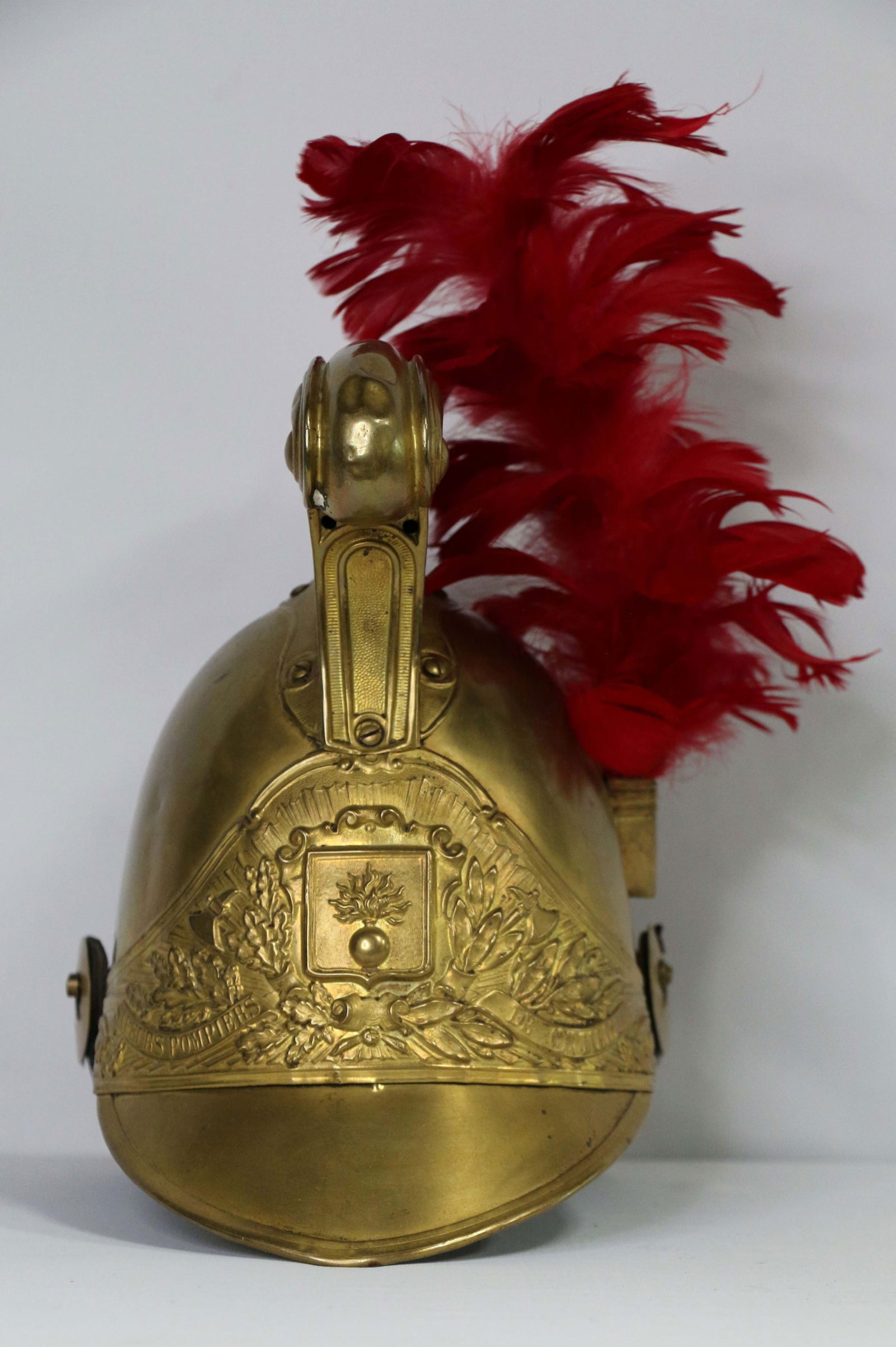 French Military Helmet: French helmet; Gold-toned metal; Embossed on the front; No maker marks observed; Measures approximately H 10 x W 7 1/4 x D 11 inches; Chin strap is broken; Wear commensurate with age; See photos. Pick