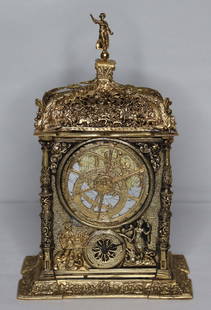 Astronomical Table Clock: Ornate clock with dials/faces on all sides; Figural finial; Only front is working clock, the other dials are purely optical; No maker marks observed; Measures approximately H 11 x W 7 x D 4 1/2; Worki