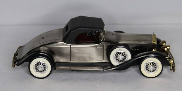 Rolls Royce, Model Car Radio: 1931 Rolls Royce model car; Battery operated, possibly a radio; Marked "Made in Japan"; Measures approximately H 3 1/4 x W 3 1/2 x D 9 3/4 inches; One light and hood ornament are broken; See photos. P