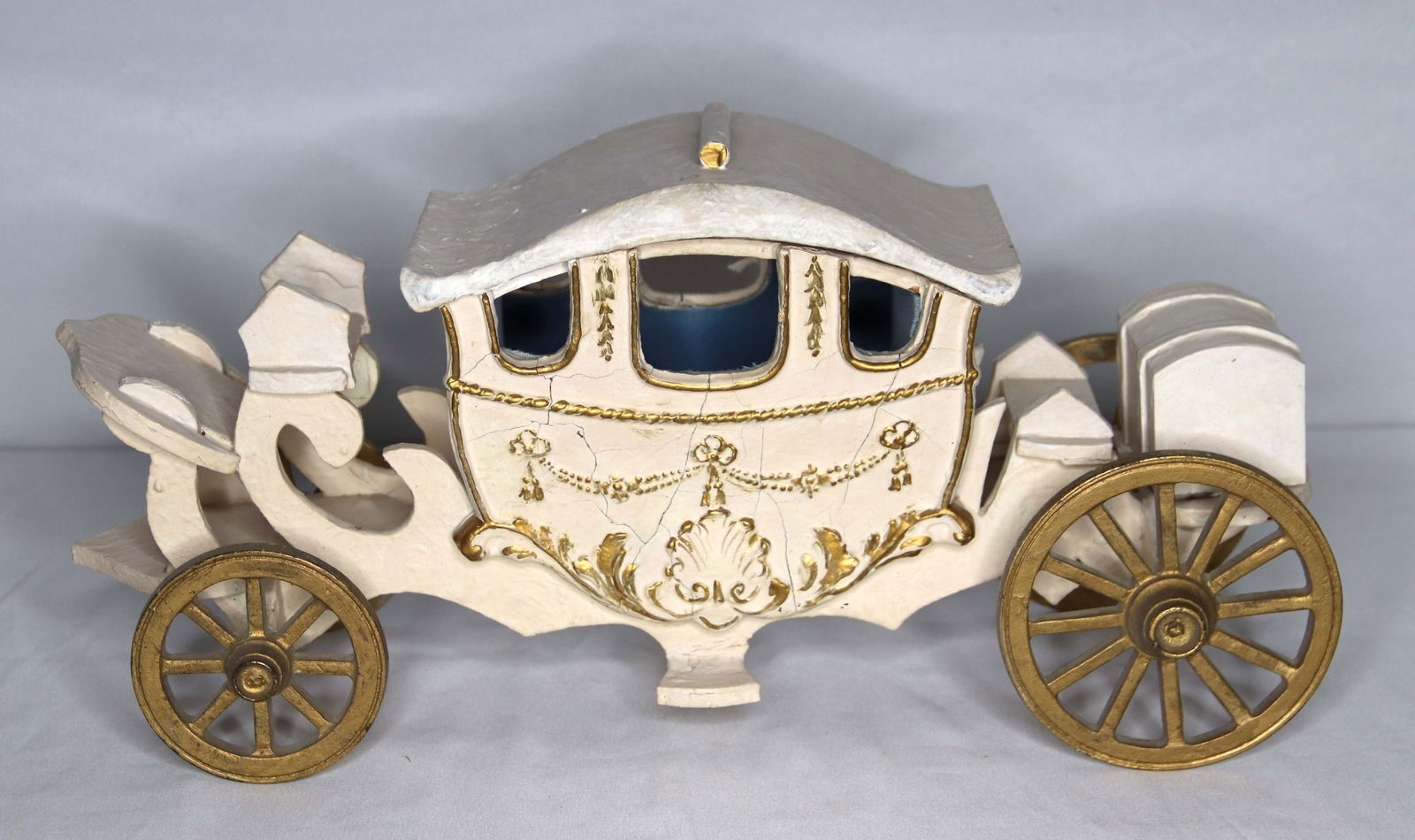 Vintage Wood Carriage: Painted wood coach; No maker marks observed; Measures approximately H 8 x W 17 x D 5 1/2 inches; Cracked on both side; See photos. Pick up in Denver