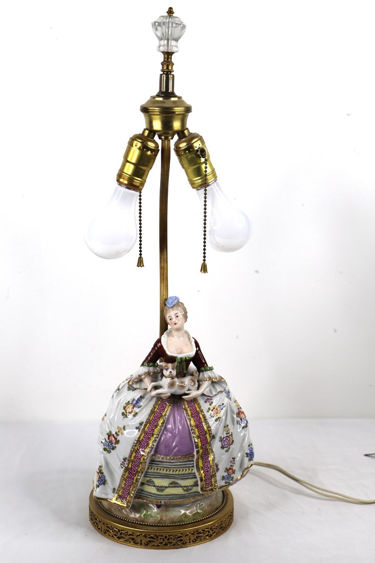 Porcelain Figural Lamp: Porcelain figurine has been converted into a lamp; Accompanying tag identifies this as Meissen and there is a mark on the back of the figurine; Lamp measures approximately H 23 x W 9 x D 8 inches; Wea