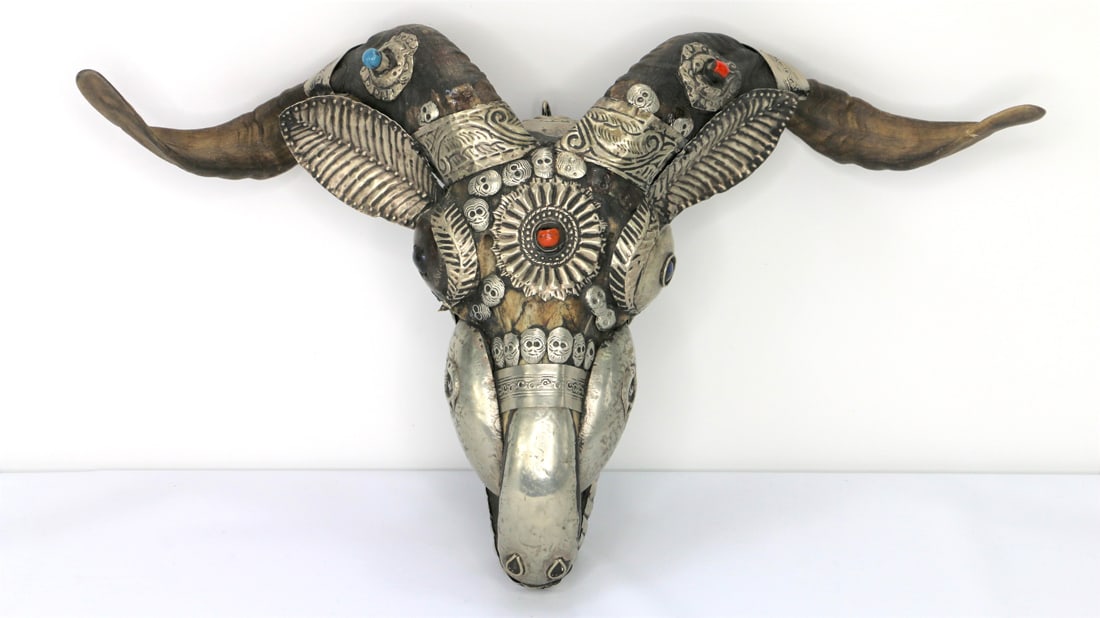 Shamanic Tibetan Goat Skull: Kabala style goat skull / mask; Possibly decorated with sterling silver and turquoise stones; No marks observed; Measures approximately H 9 x W 16 x D 5 inches; Some dents and tarnishing. See photos