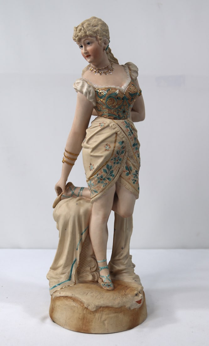 Bisque Figurine: Vintage figurine of a lady; Unknown mark on base; Measures approximately H 15 inches; Very dusty; No damage observed. See photos