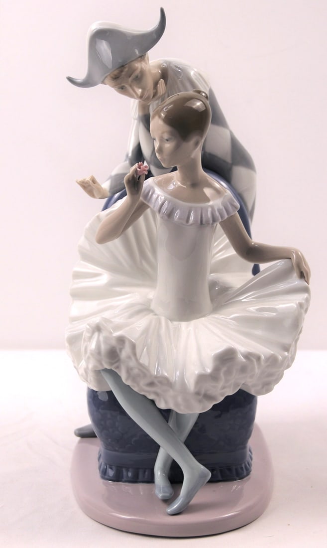 Lladro Nao, Figurine: "Dream Come True" ballerina and jester/harlequin figurine; Ballerina has a tiny pink flower in her hand; Measures approximately H 12 1/4 x W 8 1/4 x D 4 1/2 inches; No damage observed. See photos