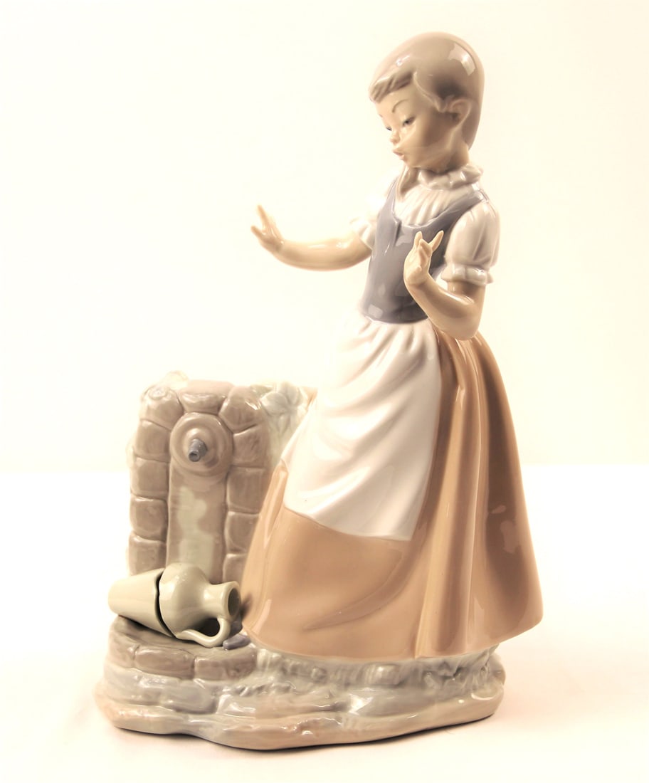 Lladro Nao, Figurine: Lladro Nao Figurine of girl with broken jug; "Made in Spain" mark on the bottom; Measures approximately H 11 1/2 x W 8 1/4 x D 4 3/4 inches; No damage observed. See photos