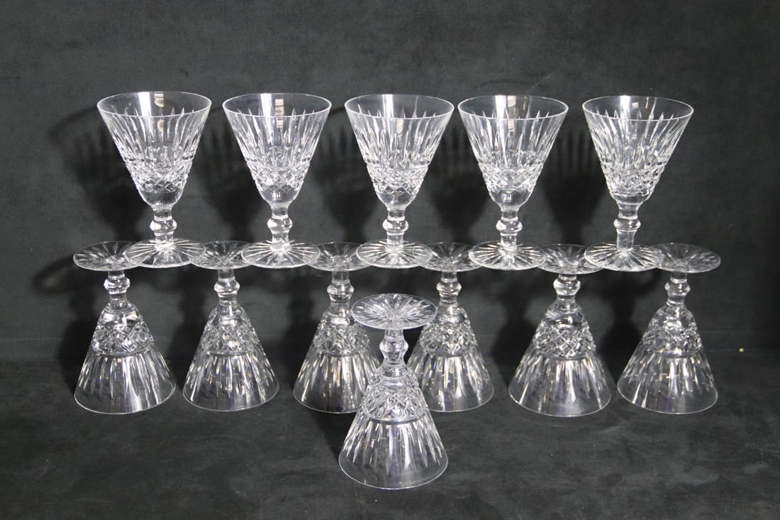 Waterford, Claret Wine Glasses: Twelve crystal stemmed claret wine glasses in the Tramore pattern; Glasses measure approximately H 5 1/4 x 3 3/4 Diameter inches across the top; No damage observed. See photos