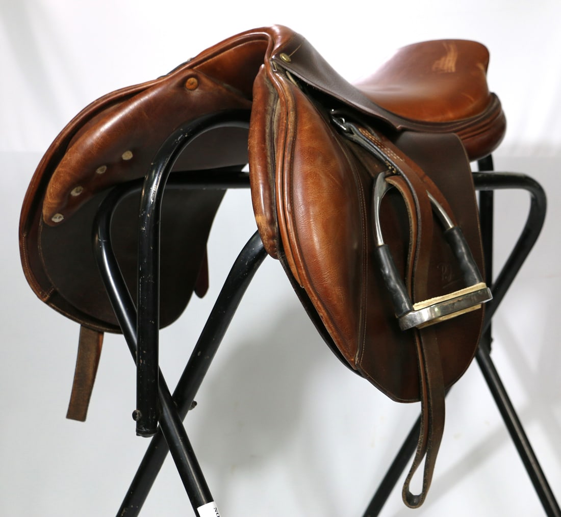 Delgrange, Hunt Seat Saddle: Bruno Delgrange English hunt seat saddle; 17 inch seat; Flap measures W 12 x L 13 1/2 inches; Includes stirrup leathers and irons; Saddle leather has surface wear and scratches; Seat has visible leath