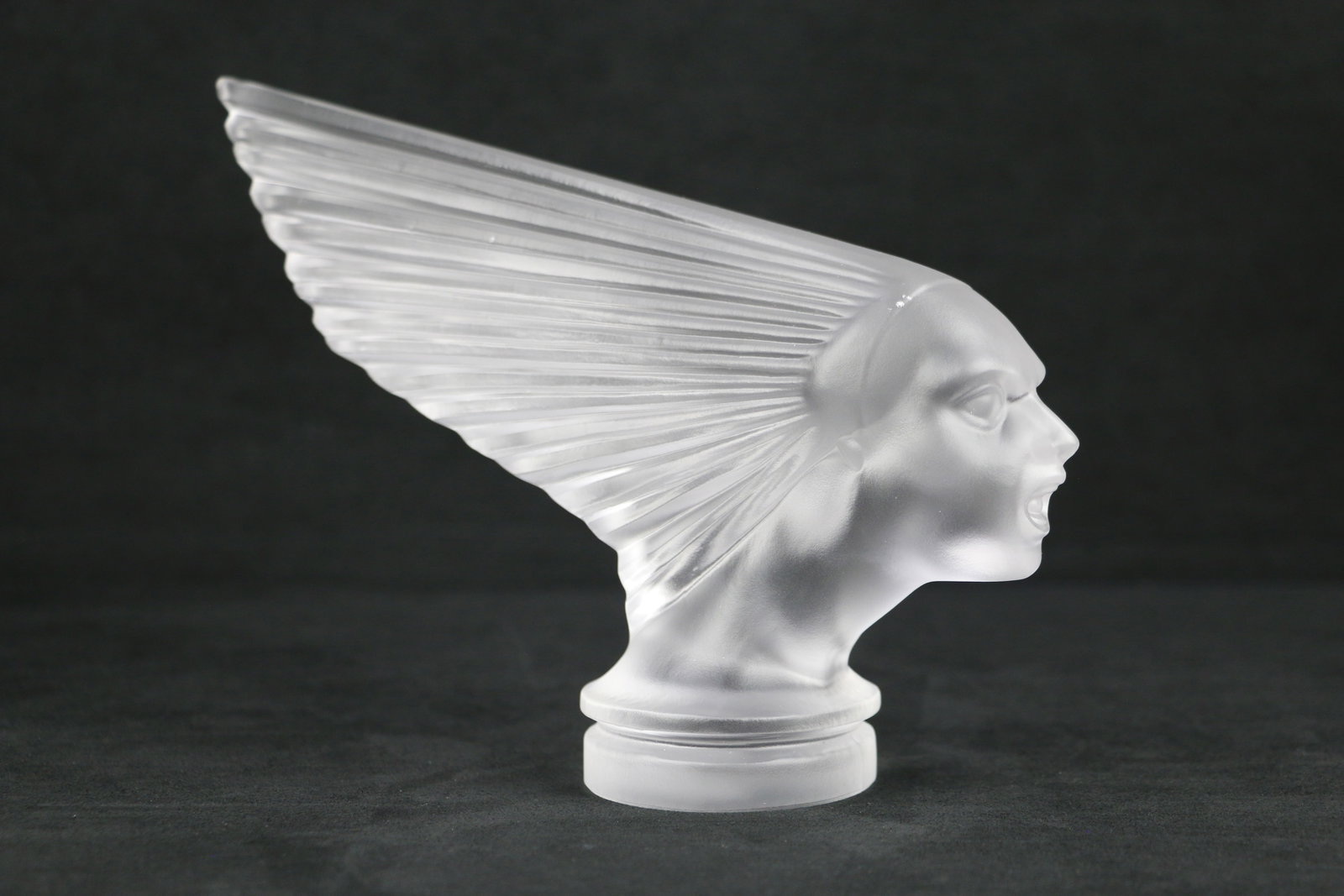 Art Deco, Victoire, Car Mascot: Frosted crystal figurine, car ornament, in the style of Lalique; No maker marks observed; Measures approximately H 6 1/2 x W 9x D 2 3/4 inches; Small chips in glass. See photos (T1)