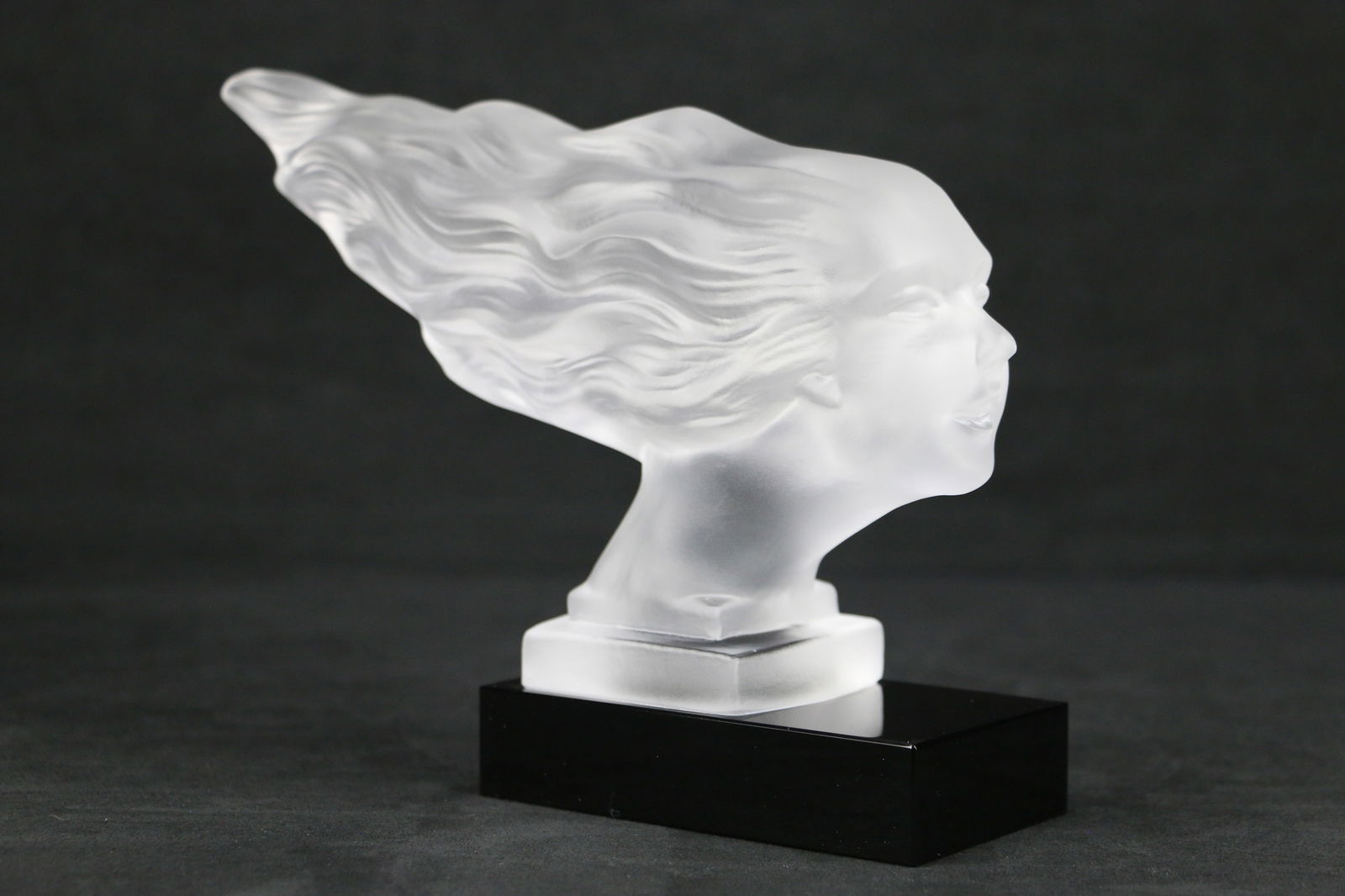 Art Deco, Speed Girl, Hood Ornament: Frosted crystal figurine, car ornament, in the style of H. Hoffman by Lalique; No maker marks observed; Measures approximately H 6 1/4 x W 8 1/2 x D 3 inches; Small chips in glass. See photos (T1)