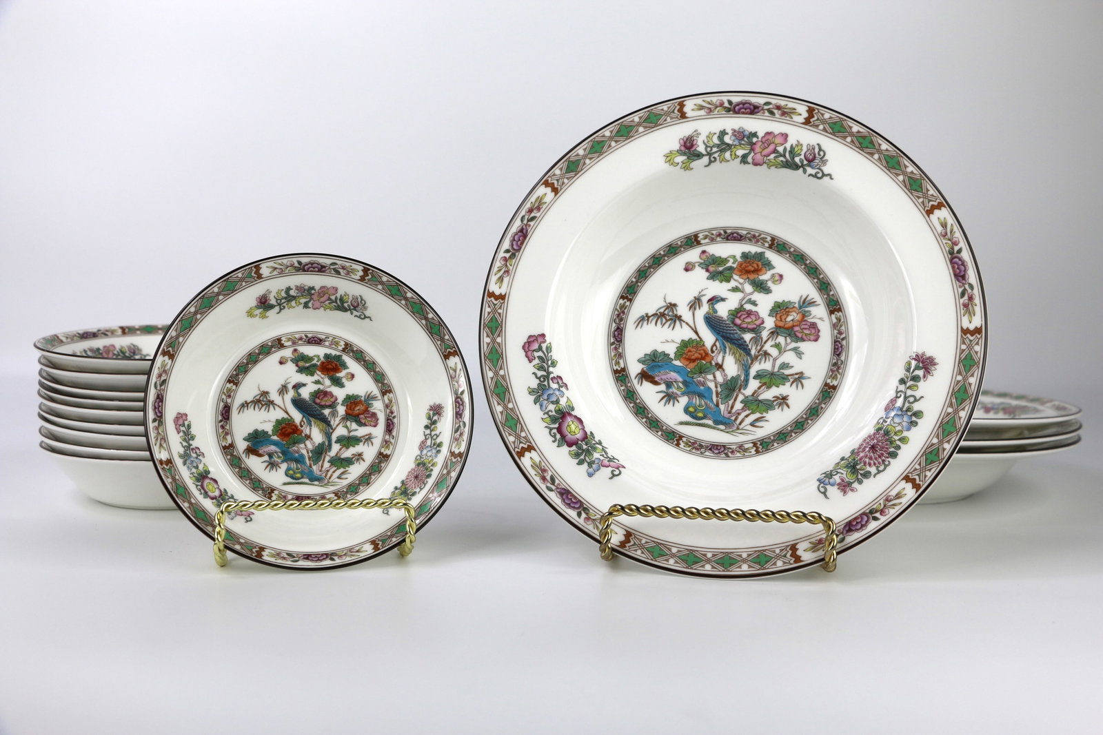 Wedgwood, Soup, Berry Bowls: Four rimmed soup bowls; Ten fruit bowls / nappies; All are in the Kutani Crane pattern; Rimmed soup measures approximately H 1 1/4 x Diameter 8 inches; In used condition; No damage observed. See photo