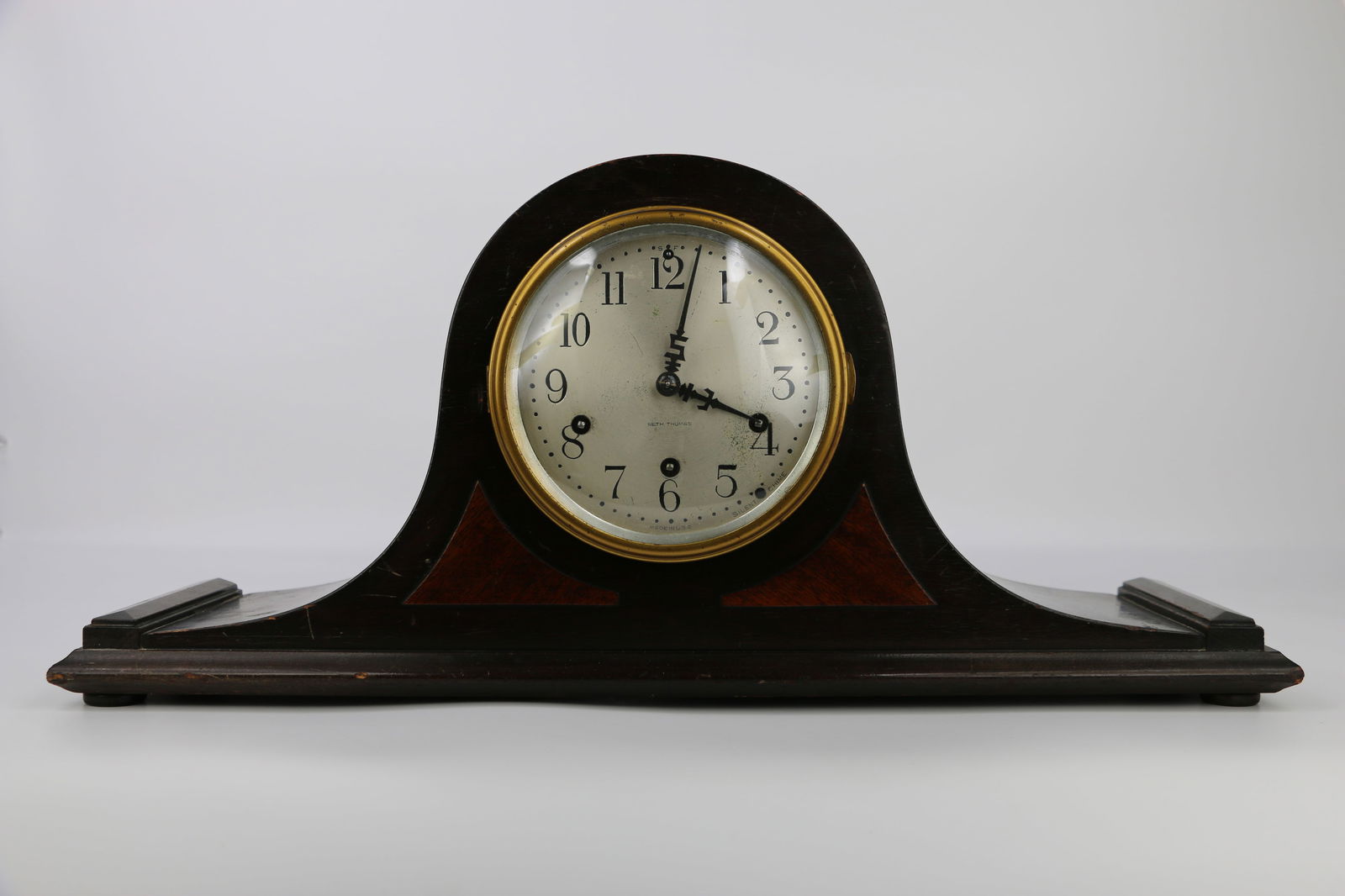Seth Thomas, Mantle Clock: Vintage wood mantle clock with silent chime; Made in the USA; Measures approximately H 9 1/4 x W 20 1/2 x D 5 1/2 inches; No key; Working condition unknown; Scratches in wood, wear on gold color trim.