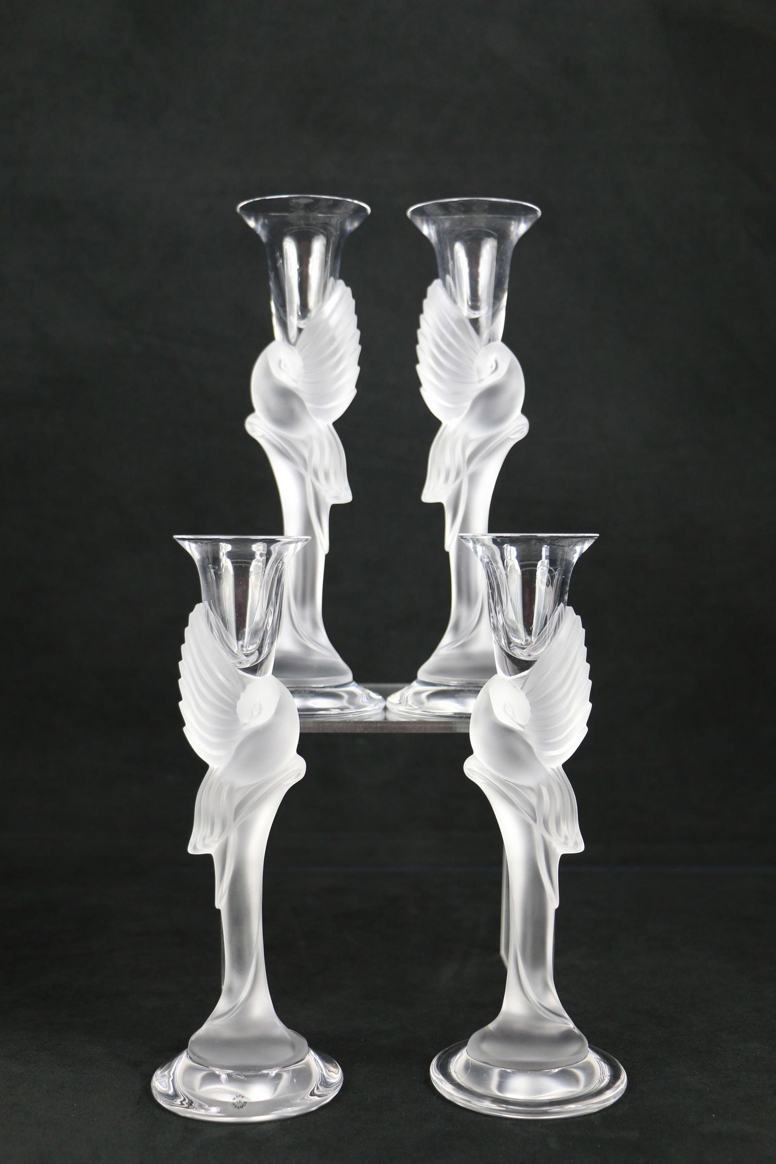 Faberge, Candlesticks: Four frosted crystal Snow Dove candle holders; Marked on base "Igor Carl Faberge, France"; Each measures approximately H 9 inches; No damage observed. See photos