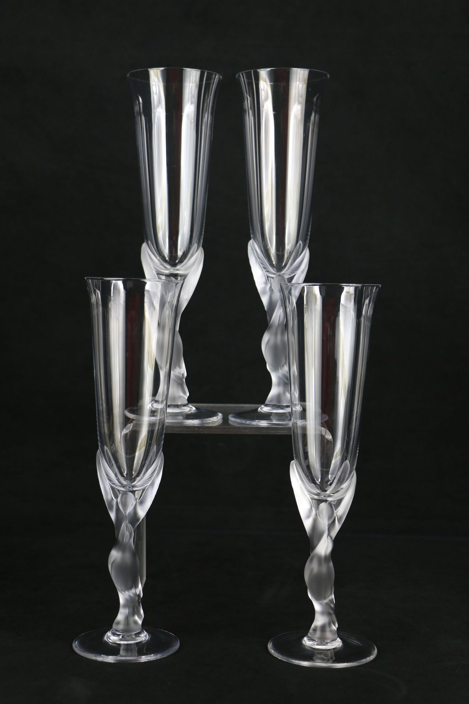 Faberge, Champagne Flutes: Four frosted crystal Snow Dove champagne glasses; Marked on base "Igor Carl Faberge, France"; Each measures approximately H 9 3/4 inches; No damage observed. See photos