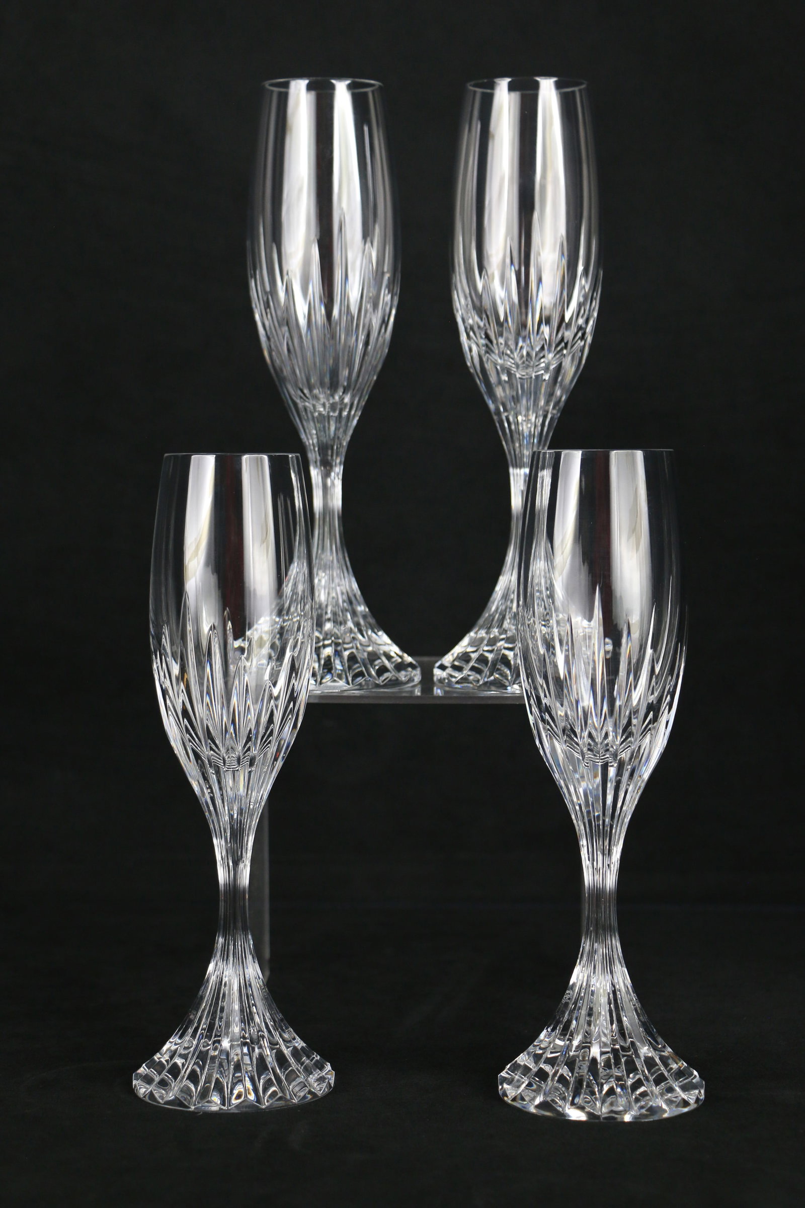 Baccarat Crystal, Champagne Flutes: Four crystal champagne glasses marked "Baccarat France" on the bottom; In the Massena pattern; Each glass stands approximately H 8 3/4 inches; No damage observed. See photos