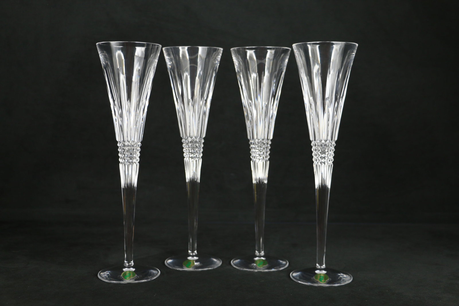 Waterford Crystal, Champagne Flutes: Four crystal champagne glasses in the Lismore Diamond pattern; Each measures approximately H 11 inches; No damage observed. See photos