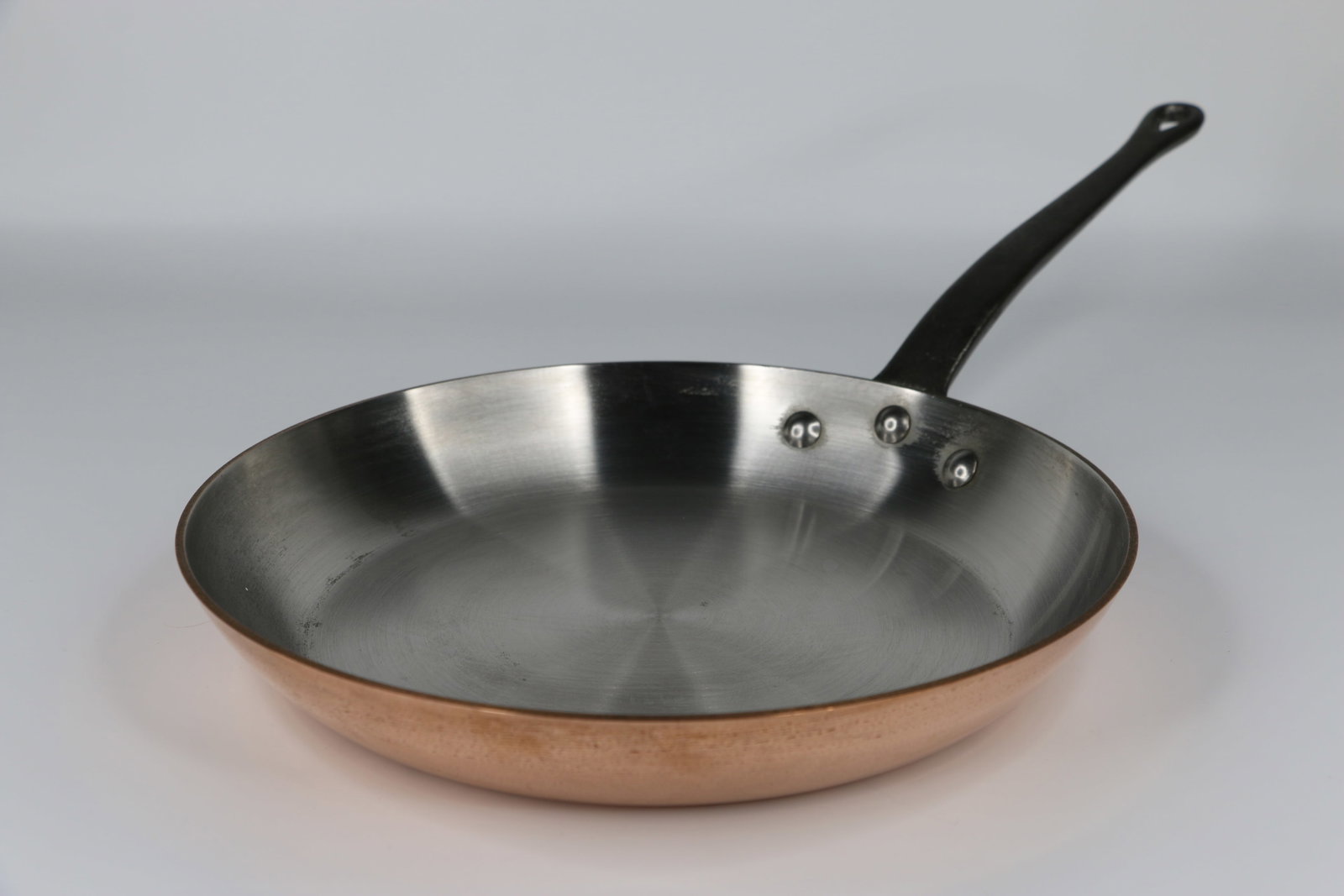 Mauviel, Copper Frying Pan: Made in France; Measures approximately H 2 x Diameter 10 1/2 inches; In used condition; Scratching on the bottom. See photos