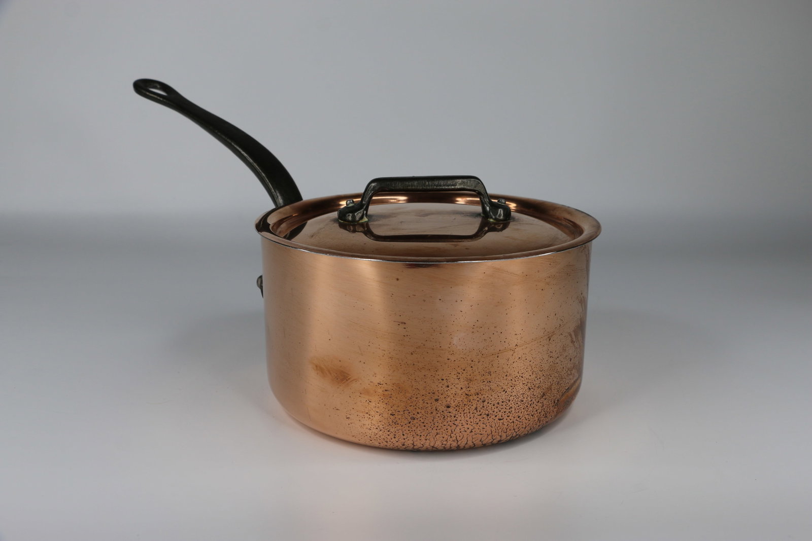 Mauviel, Copper Pan: Pot with lid; Still has manufacturers sticker inside pot; Measures approximately H 4 x Diameter 7 inches; Scratches on bottom and slight tarnishing on copper. See photos