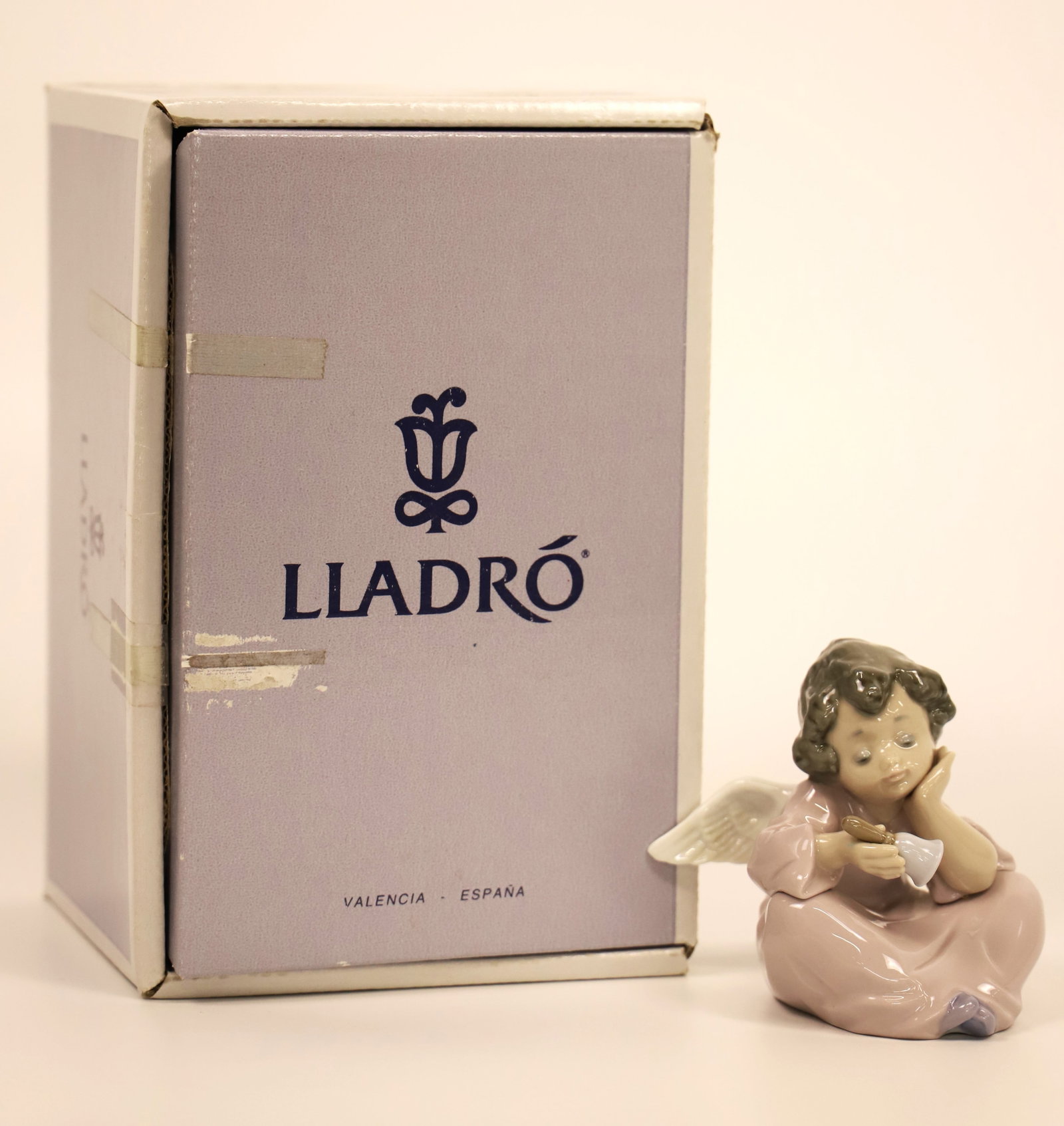 Lladro, Figurine: Small angel; Number 5723; In original box; Measures approximately H 3 1/2 x W 3 x D 3 inches; No damage observed on angle; Box is worn. See photos