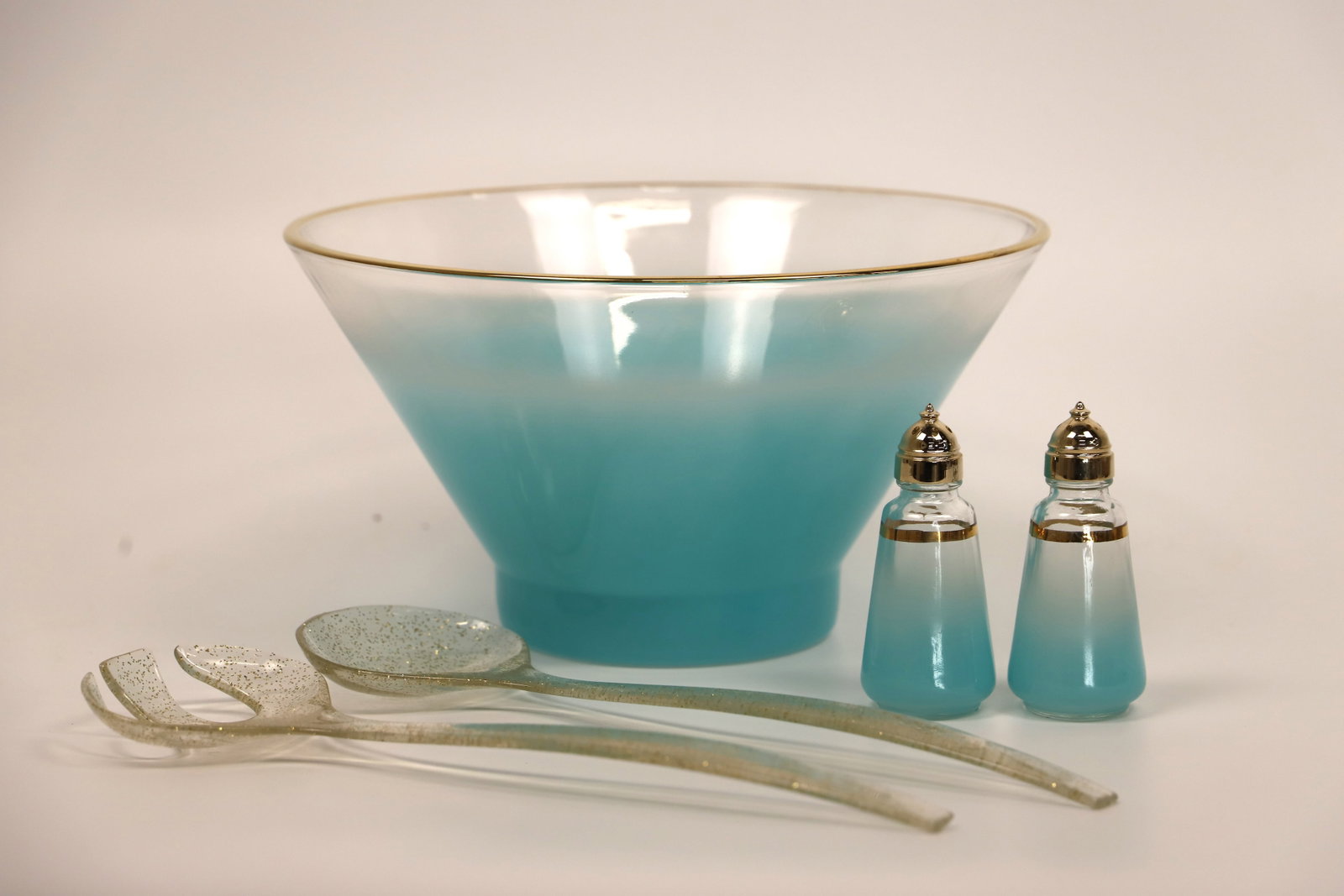 MCM Salad Bowl: Mid-Century Modern frosted salad bowl; Possibly Blendo; Salt and pepper are marked Anchor Hocking; Acrylic salad spoons; Bowl measures approximately H 6 x Diameter 10 3/4 inches; slight scratching in 