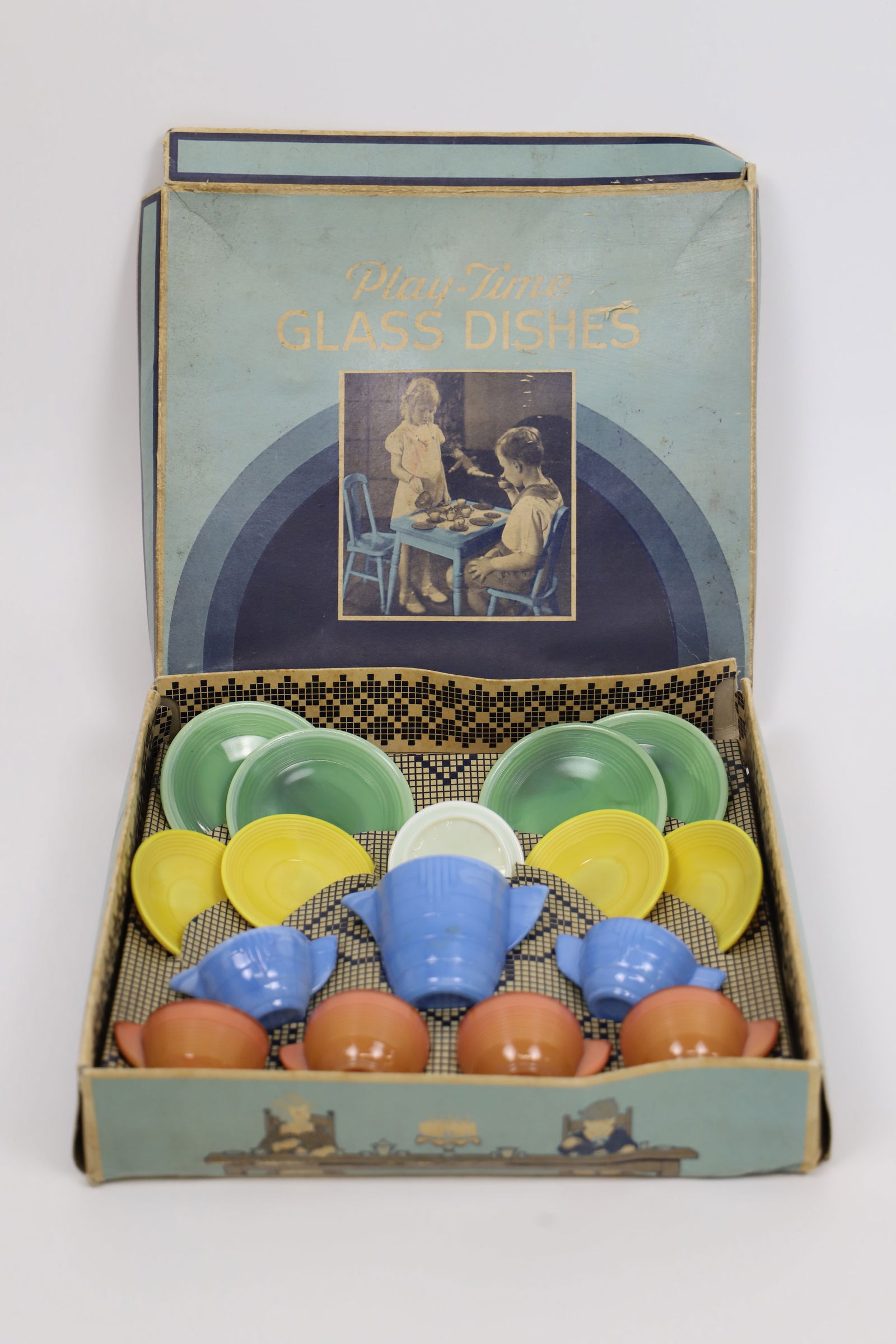 Akro Agate Co., Tea Set: Vintage Play-Time Glass Dish Set; Called "A Gypsy Tea Set"; In original box; Box measures approximately H 2 1/2 x W 11 x D 9 1/2 inches; Box is damaged. See photos