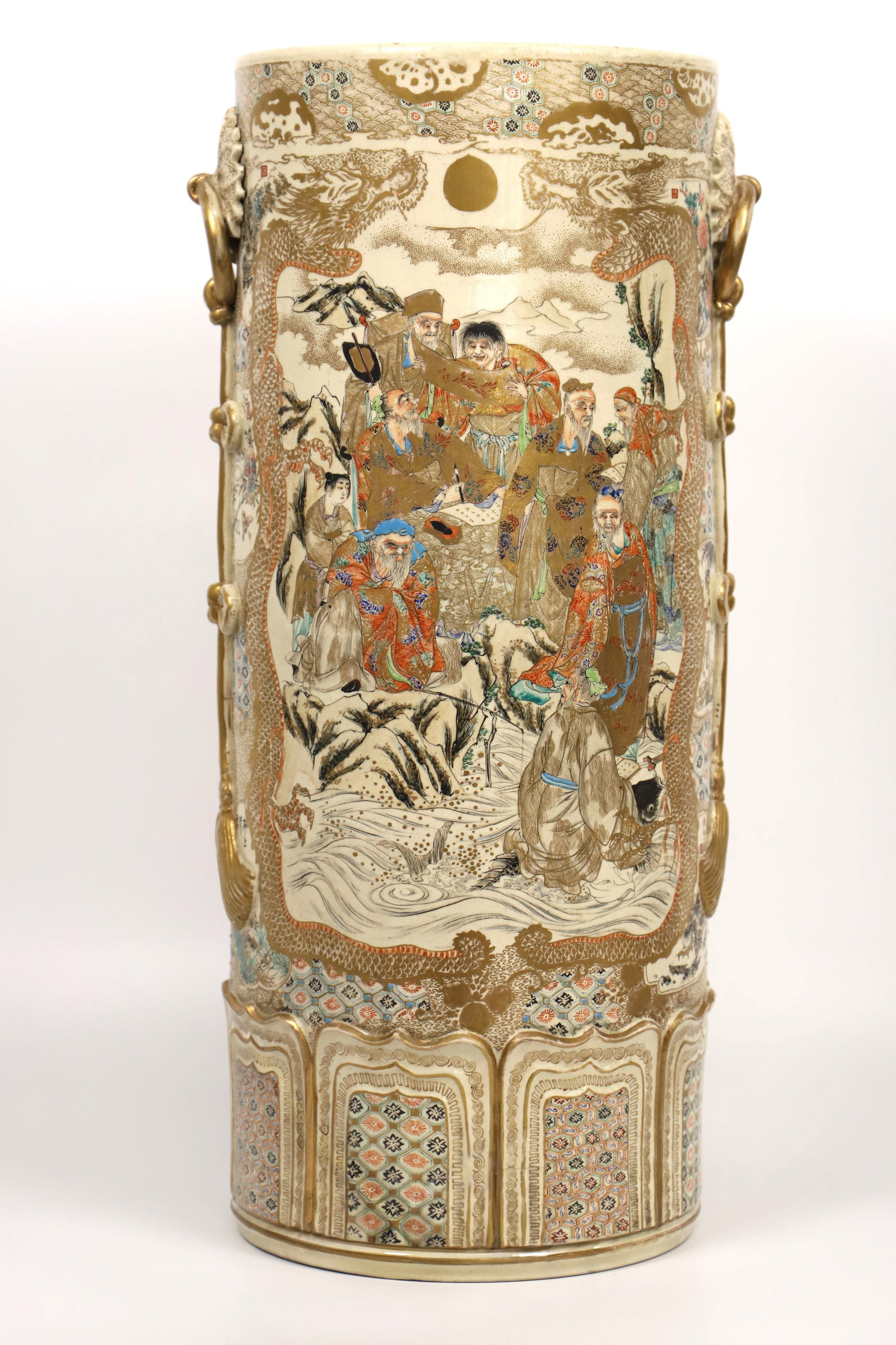 Japanese, Umbrella Stand: Satsuma ceramic umbrella stand; No maker marks observed; Measures approximately H 24 1/2 x Diameter 10 inches; Tape residue and scratches on the inside. See photos