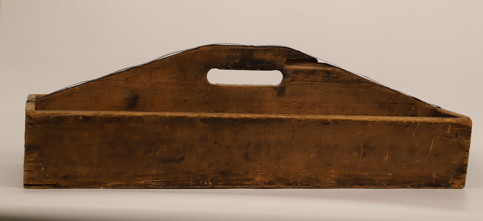 Wood Tool Box: Vintage wood tool box; Possibly handmade; Has metal over the handle; Measures approximately H 10 x W 33 x D 12 1/2 inches; Wear commensurate with age. See photos