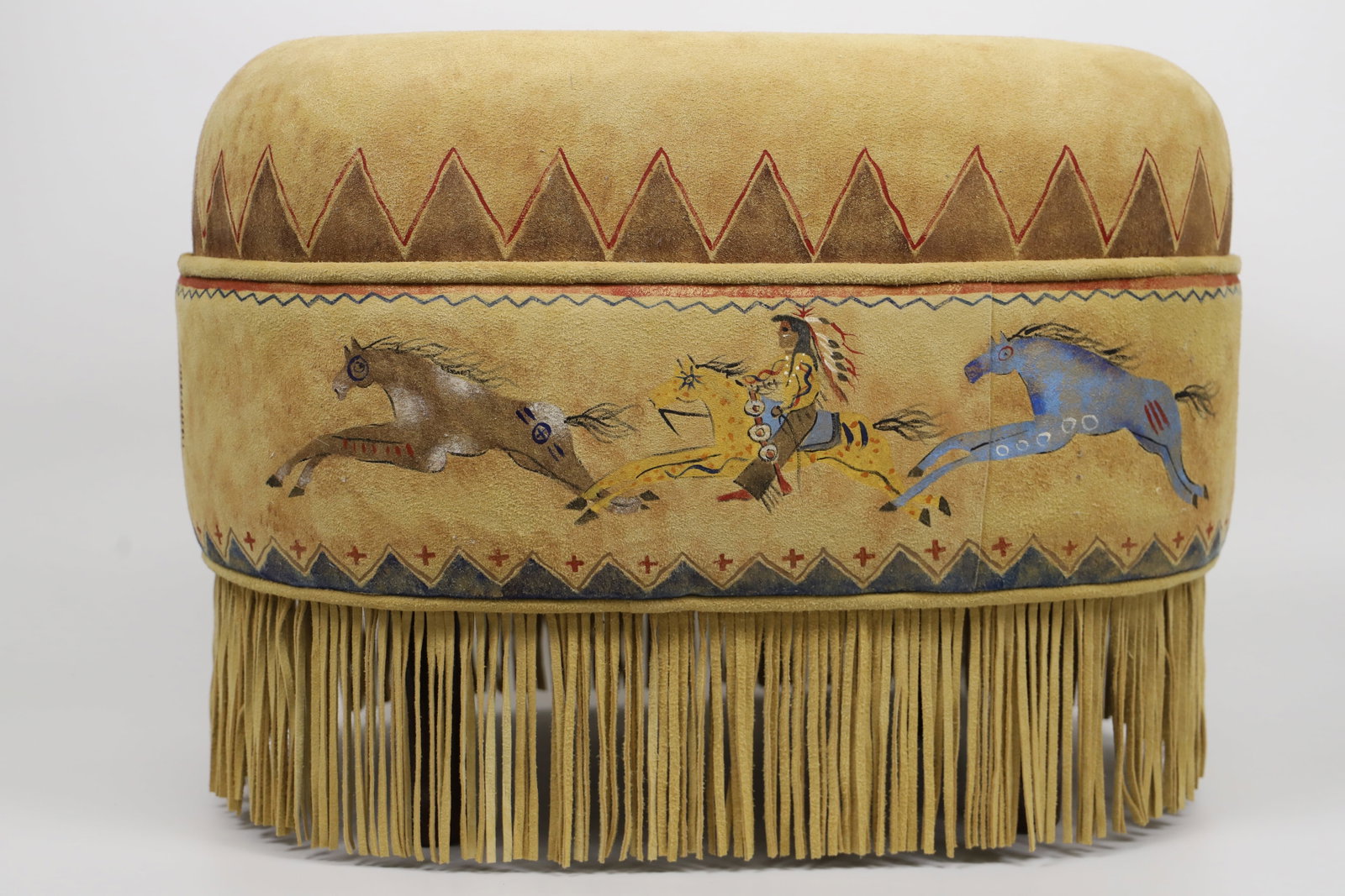 Patricia Wolf, Cayuse Ottoman: Painted suede (possibly deerskin) ottoman; Measures approximately H 16 x W 22 x D 15 inches; No damage observed. See photos