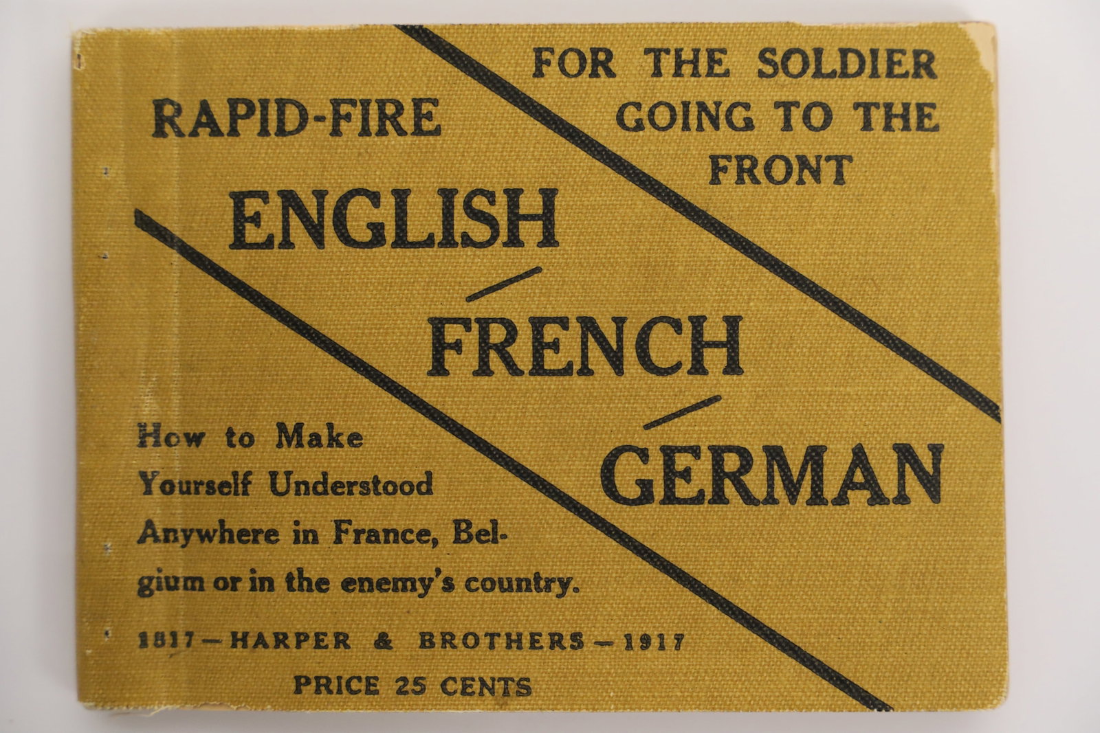 Antique Soldier Dictionary: "Rapid Fire English, French, German" World War I trench slang; Copyright 1917; For the use of soldiers and sailors and the men and women of the Army and Navy medical corps; Book measures approximately