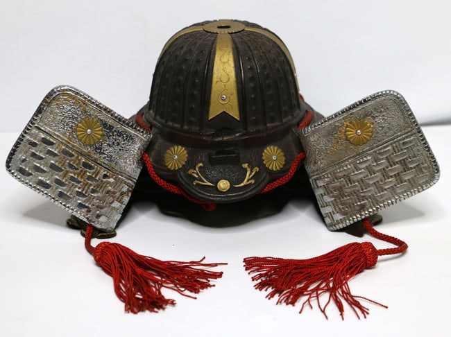 Japanese Warrior Helmet: Metal replica of a Samurai helmet; No marks observed; Measures approximately H 7 x W 12 1/2 x D 9 inches; Scratches and wear on metal; See photos