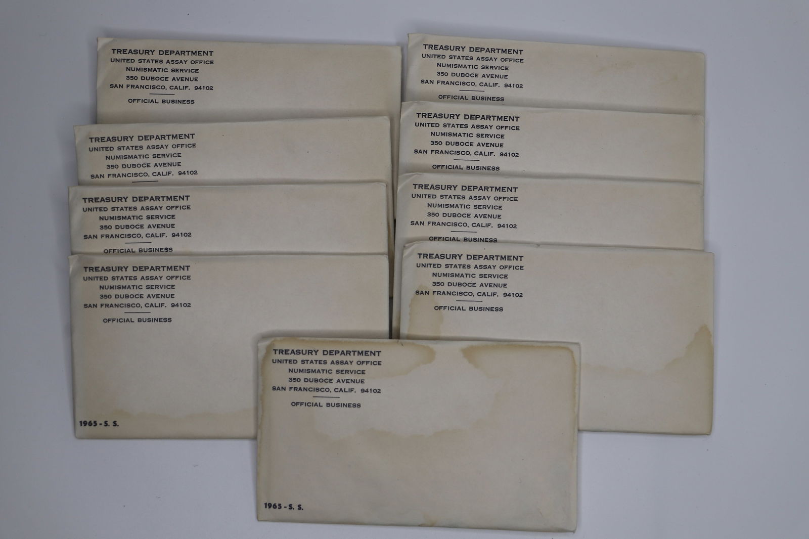 1965 US Special Mint Set Coins: Ten sets of 1965 special mint coin; Each envelope contains one half dollar, quarter, dime, nickel, penny; Nine sets are sealed in original envelopes. See photos