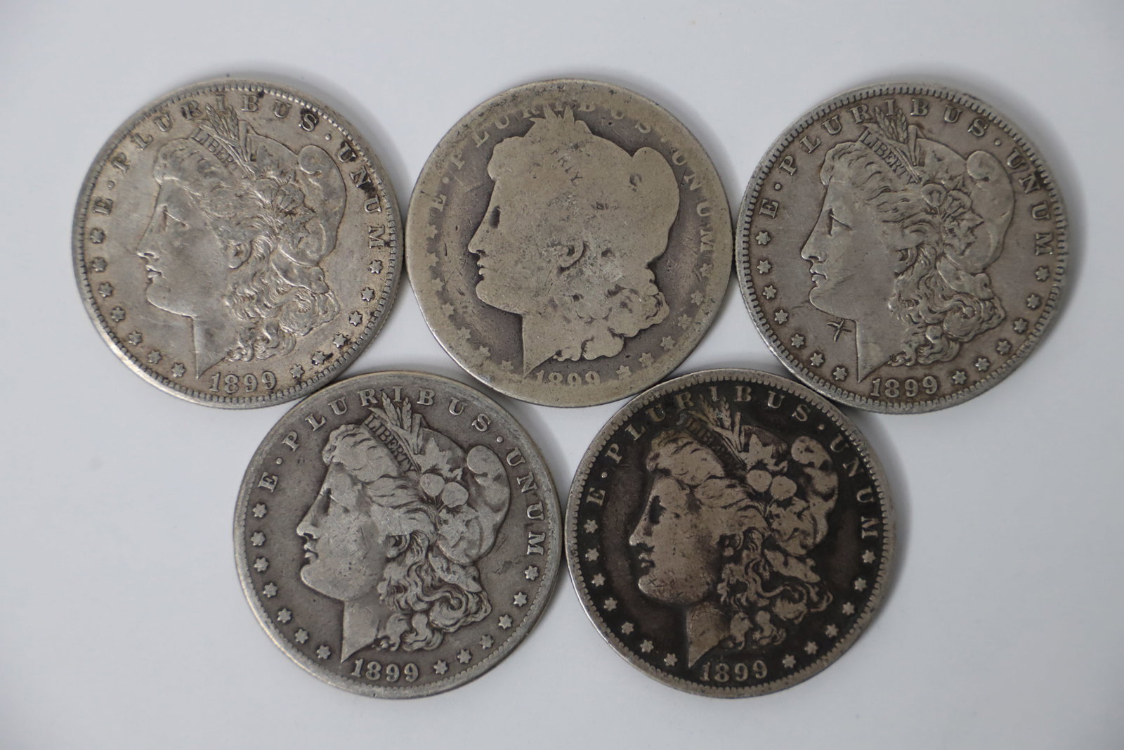 Morgan Silver Dollars: Five "O" circulated silver dollars; All are dated 1899; Total is approximately 4.170 troy ounces;See photos